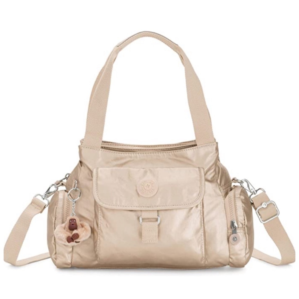 Beautiful new with tags Kipling purse in toasty gold color.